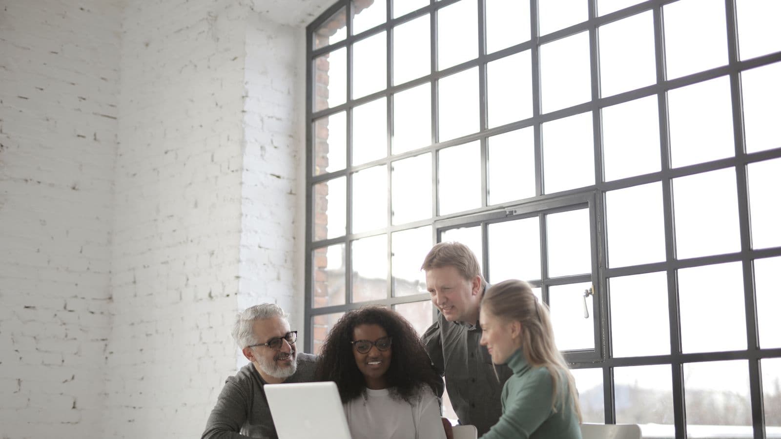 Small business owner reviewing bookkeeping records and a bank reconciliation